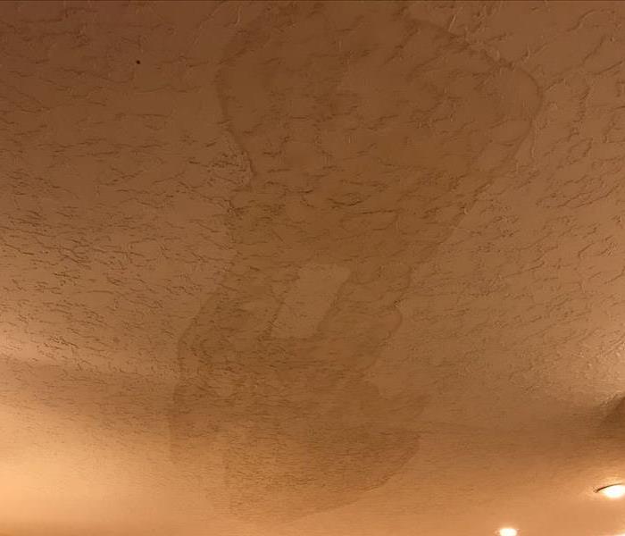 A leak in the roof that has not caused the roof to break through but has water damage. 